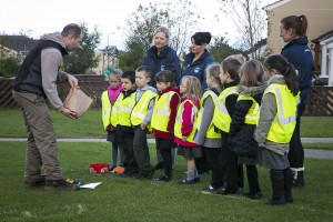 Cartrefi Conwy Peulwys Estate. Bulb planting. Children from the local primary school listen to instructions from with environemental development officer Matt Stowe.