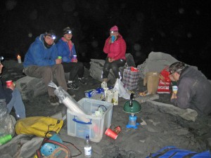 Explorers enjoying a snack during the underground sleepover.