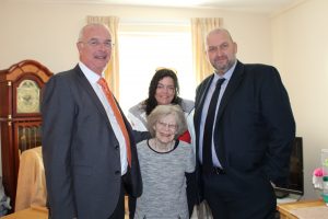 CCG Chairman Medwyn Hughes, Mrs Margaret Denman, CCG Tenant Support Officer Haf Evans and Cabinet Secretary for Communities and Children, Carl Sargeant.