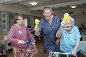 Pendine Park; Hillbury Care Home Residents working with the Welsh National Opera ahead of the International Music Eistedfodd at Llangollen. Pictured (centre) is Jenny Pearon from the Welsh Nationa Opera with residents Shirley Carrington and Margaret Newall.