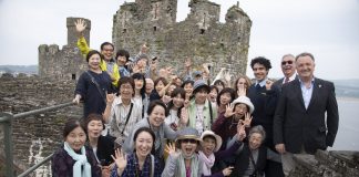 North Wales Tourism Pictured (right ) are Jim Jones, MD of North Wales Tourism Ltd in Llanduddno, ex Mayor of Conwy Cllr Bill Chapman, Leith Jawzi and Lauren Lewsley from CADW with some Japanese tourists.