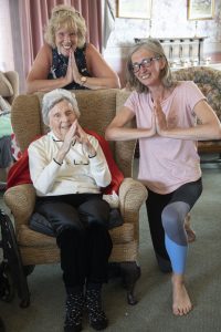 St David's Residential Home in Rhyl who have launched a new yoga class for residents ; Pictured is resident Phylis Roberts with Joan Machell, Activities coordinator and yoga coordinator Alison Jones.