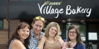 Village Bakery staff meet Baby Tao James Cooke and his parents Matt Cooke and Margaret Edwards; Pictured are Michelle Taylor Jones, Matt Cooke, Margaret Edwards and Jeanette Owens with Baby Tao James Cooke.