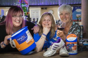 Beth Taylor who is running the Chicago Marathon in aid of motor neurone disease; Pictured is centre Beth Taylor-Lloyd with (from left) Becky Owens and Gill Ryland.