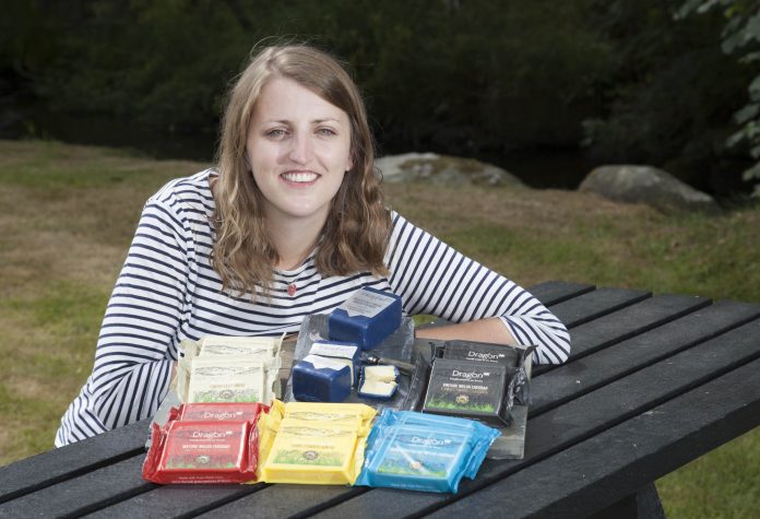 South Caernarfon Creameries have rebranded their cheeses Pictured: South Caernarfon Creameries Sales and Marketing Co-ordinator Meggi Williams with the new Dragon branded cheeses