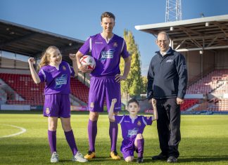Ifor Williams Trailers WFC New kit launch; Pictured is Wrexham player Jake Lawlor with Russell Williams from Ifor Williams Trailers , Maisie Scragg,10, and Callum Hogan, six.