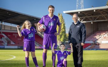 Ifor Williams Trailers WFC New kit launch; Pictured is Wrexham player Jake Lawlor with Russell Williams from Ifor Williams Trailers , Maisie Scragg,10, and Callum Hogan, six.