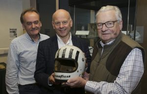 Car enthusiast Dave Jones, Mario Kreft and Lord Dafydd Elis-Thomas with Tom Pryce's helmet
